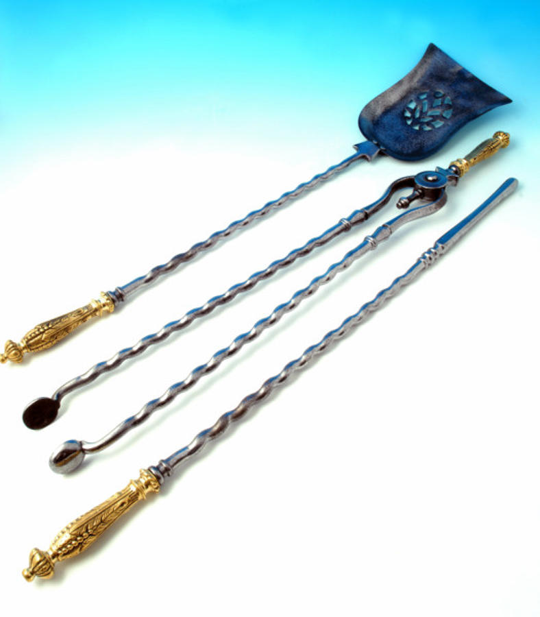 A fine set of polished Steel & Brass Fire-Irons. English C1840 - 50