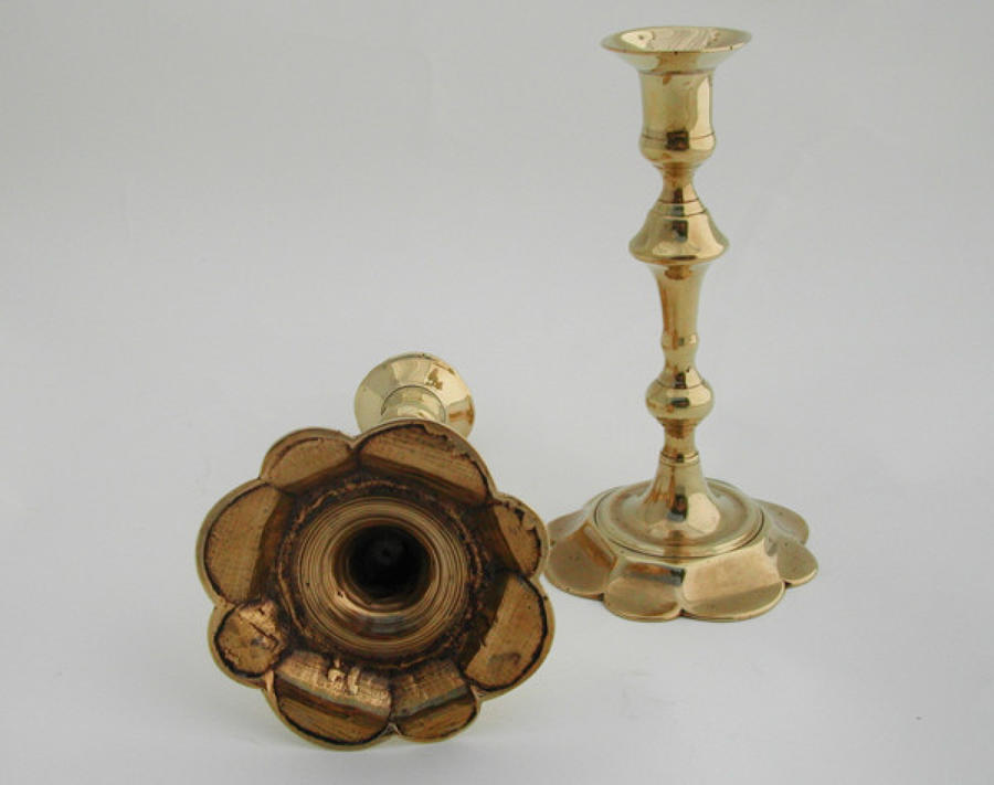 A pair of 18thc Brass petal base Candlesticks. English C1745 - 65
