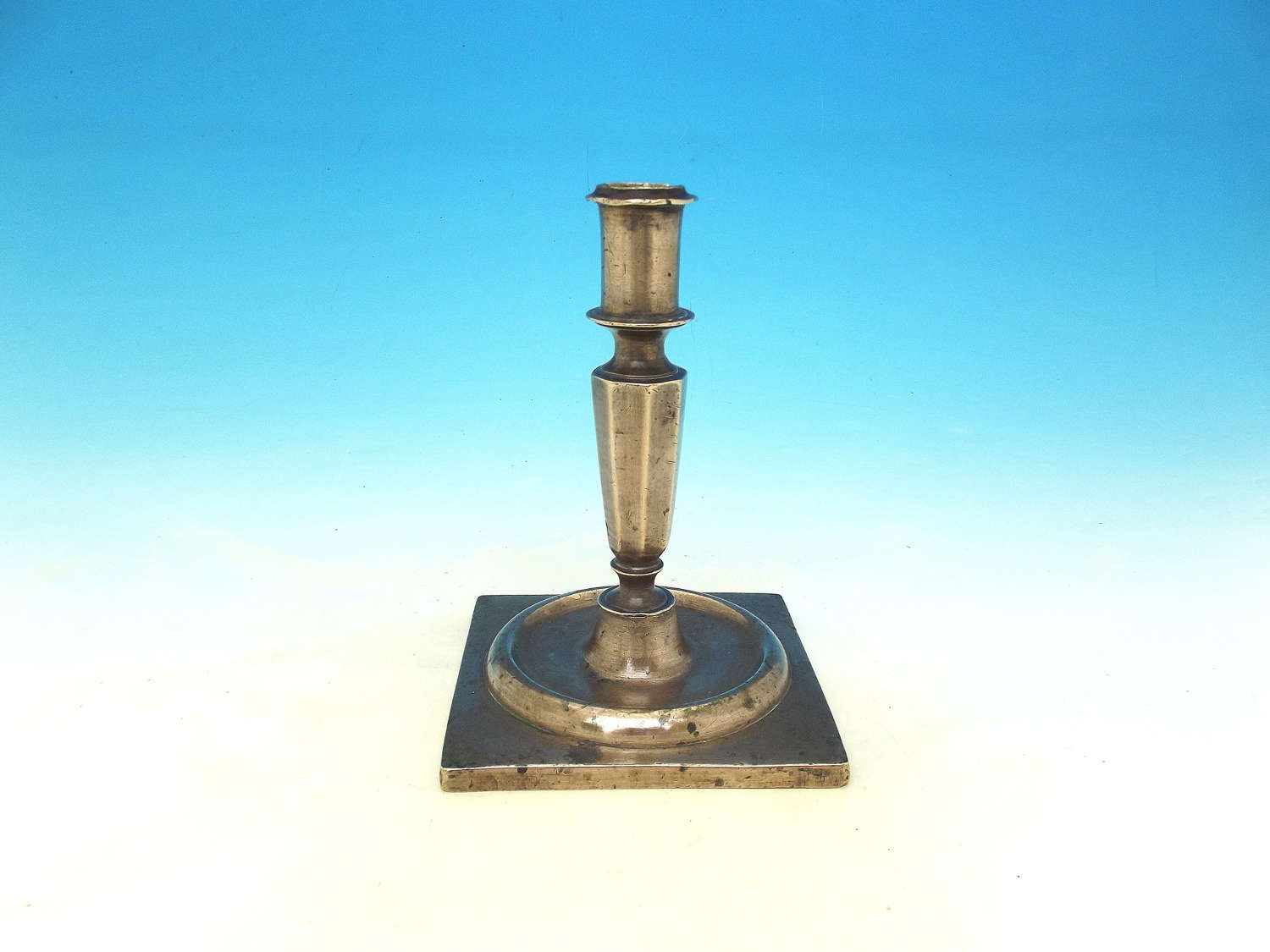 Antique Metalware 17thc Brass Single Candlestick On Square Base. C1650
