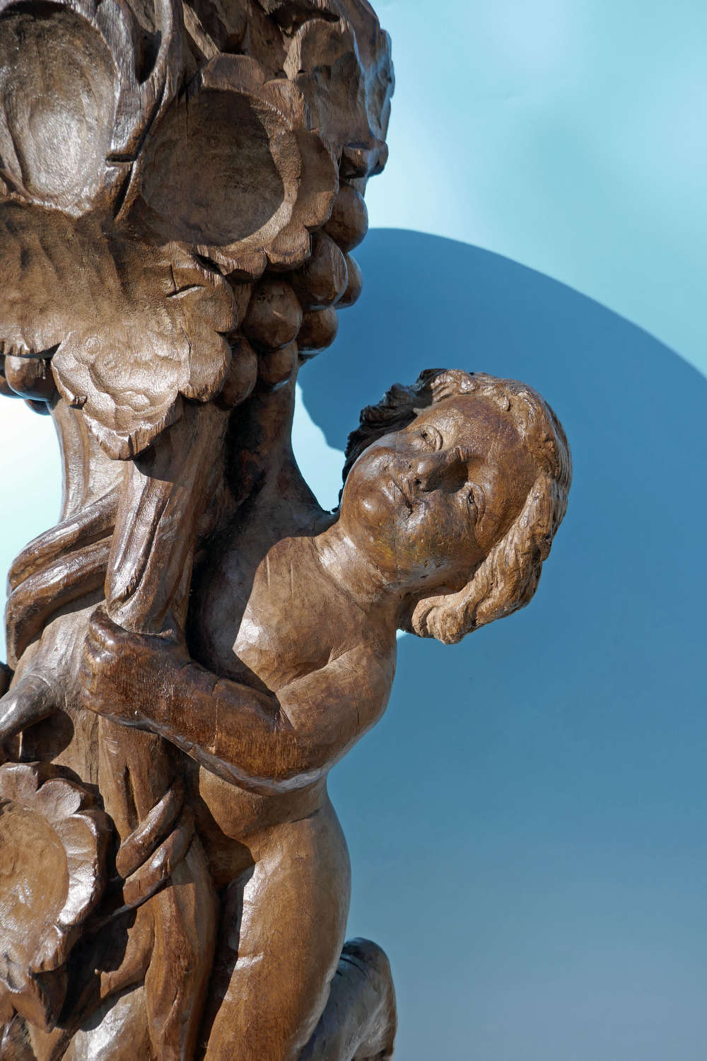 17thc Limewood Carving Of A Cherub Amongst The Grapevines.Continental